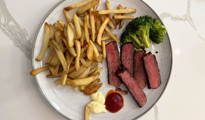 best steak delivery: crowd cow cowboy steak, on a plate with fries and broccoli