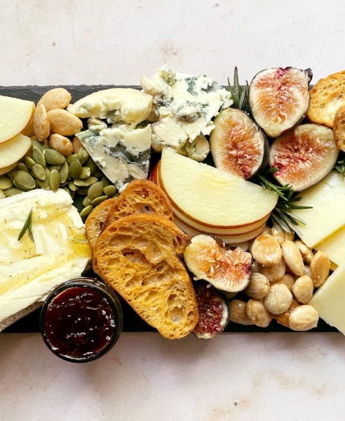 easy dinner party recipes fall charcuterie board with black pepper honey brie figs and rosemary recipe