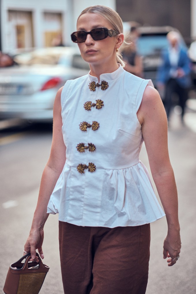 woman wearing a white peplum top