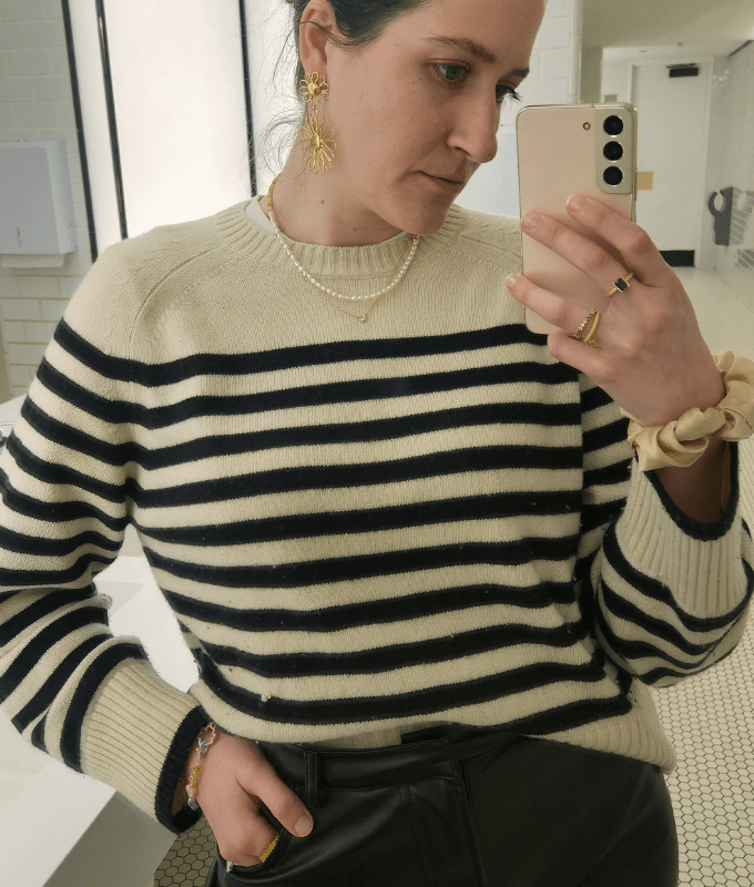 Best cashmere sweaters: J.Crew striped sweater on editor taking selfie